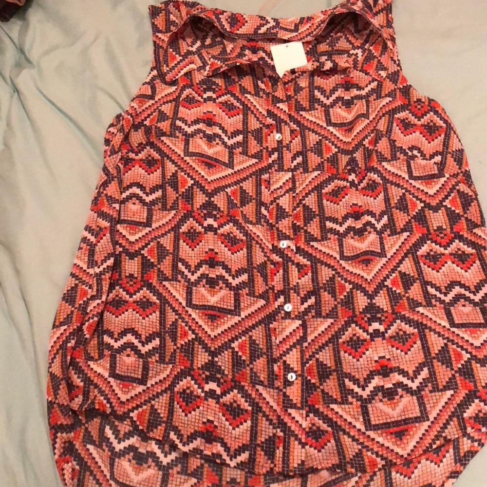 a sheer sleeveless top